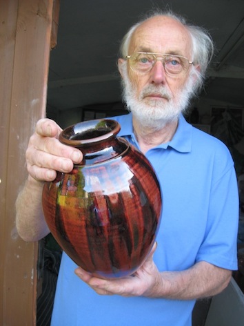 Maxwell Cowlin holding one of his pots